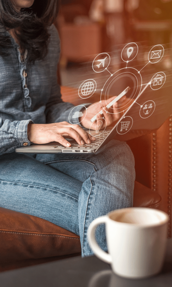 image of person on phone and laptop